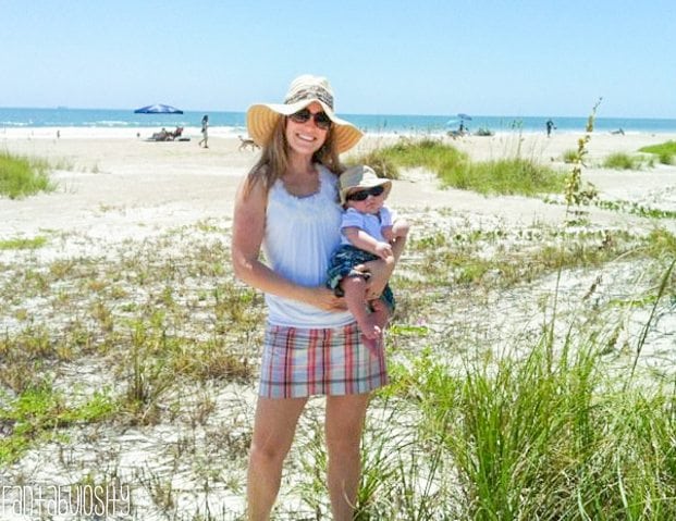 Baby on the beach with mom and sunhat in Cocoa Beach Florida