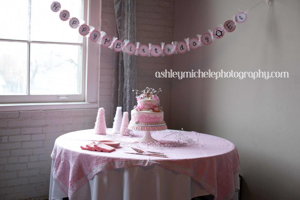 Winter Onederland Cake Table and banner Such a cute party for a little girl with all the decorations