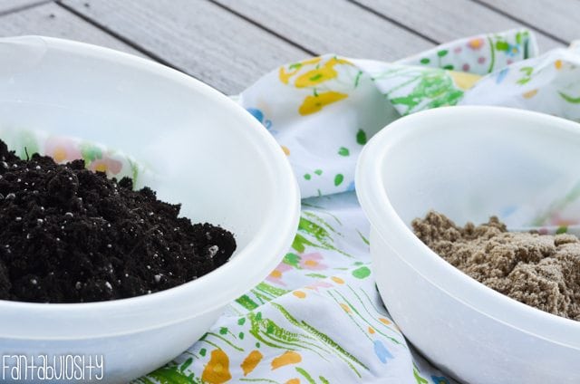 Two mixing bowls of soil and sand