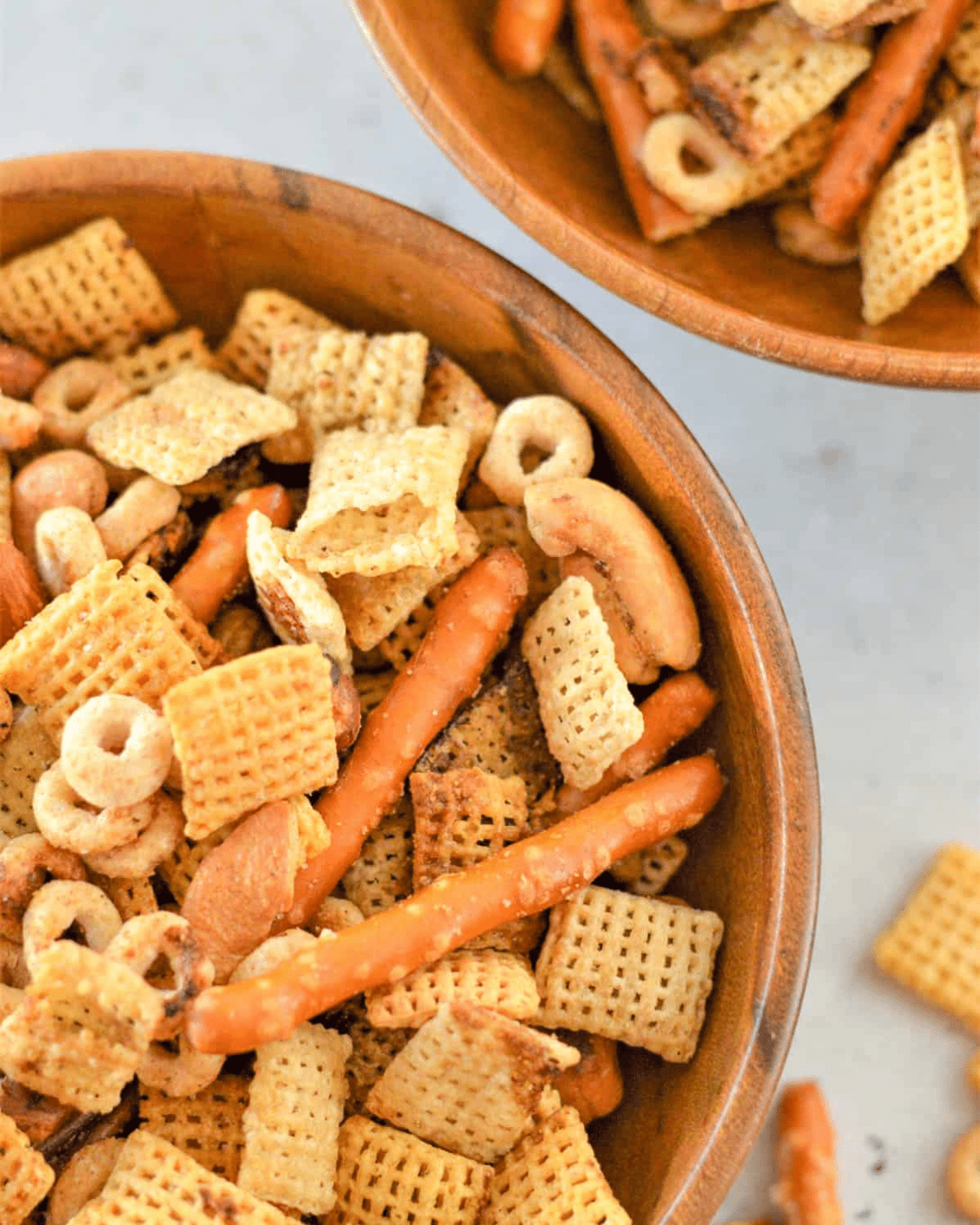 nuts and bolts snack mix in a brown bowl