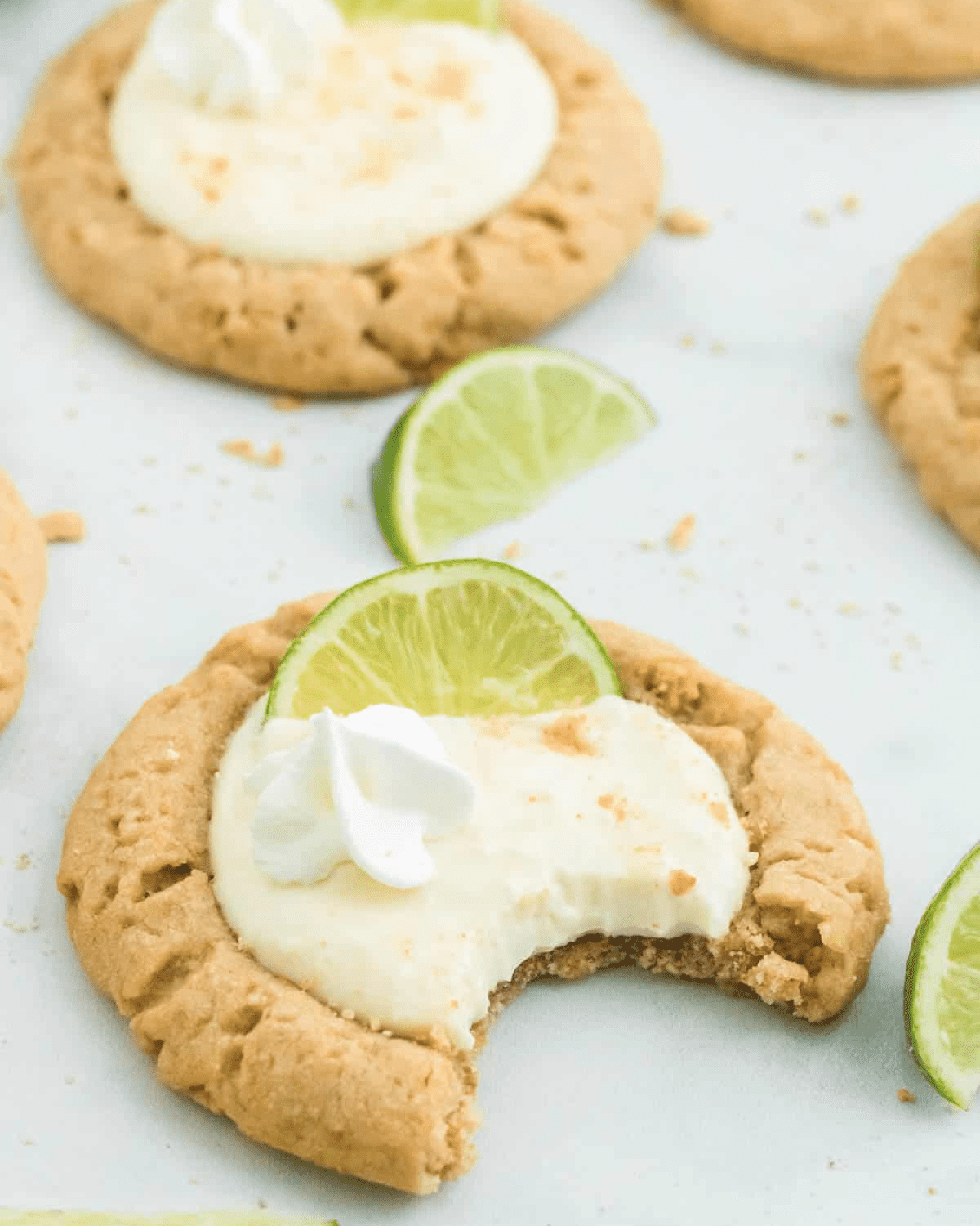 key lime cookies with a bite taken out