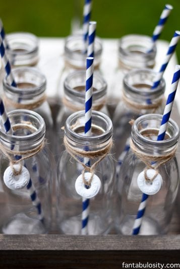 Nautical Birthday Party Ideas. Milk bottles with life savers wrapped around the neck with twine! So cute! https://fantabulosity.com