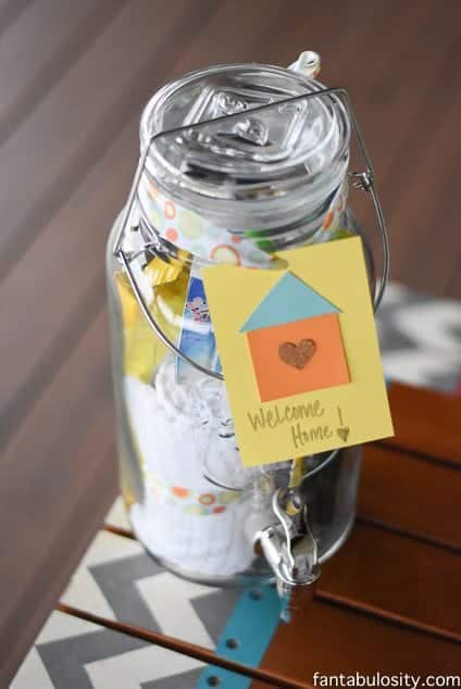 DIY Housewarming Gift Ideas. Mason Jar Drink dispenser with all of those "always need," items when moving in! Awesome! https://fantabulosity.com