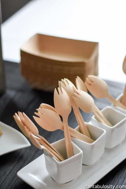 Wooden utensils in white cups