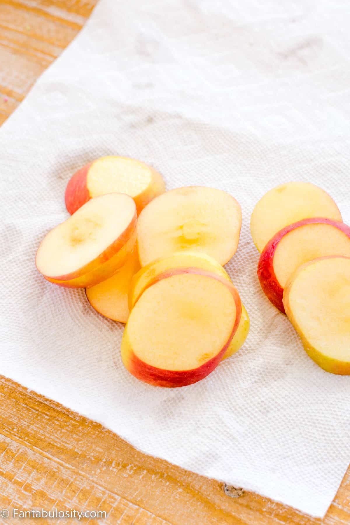 sliced apples on parchment paper