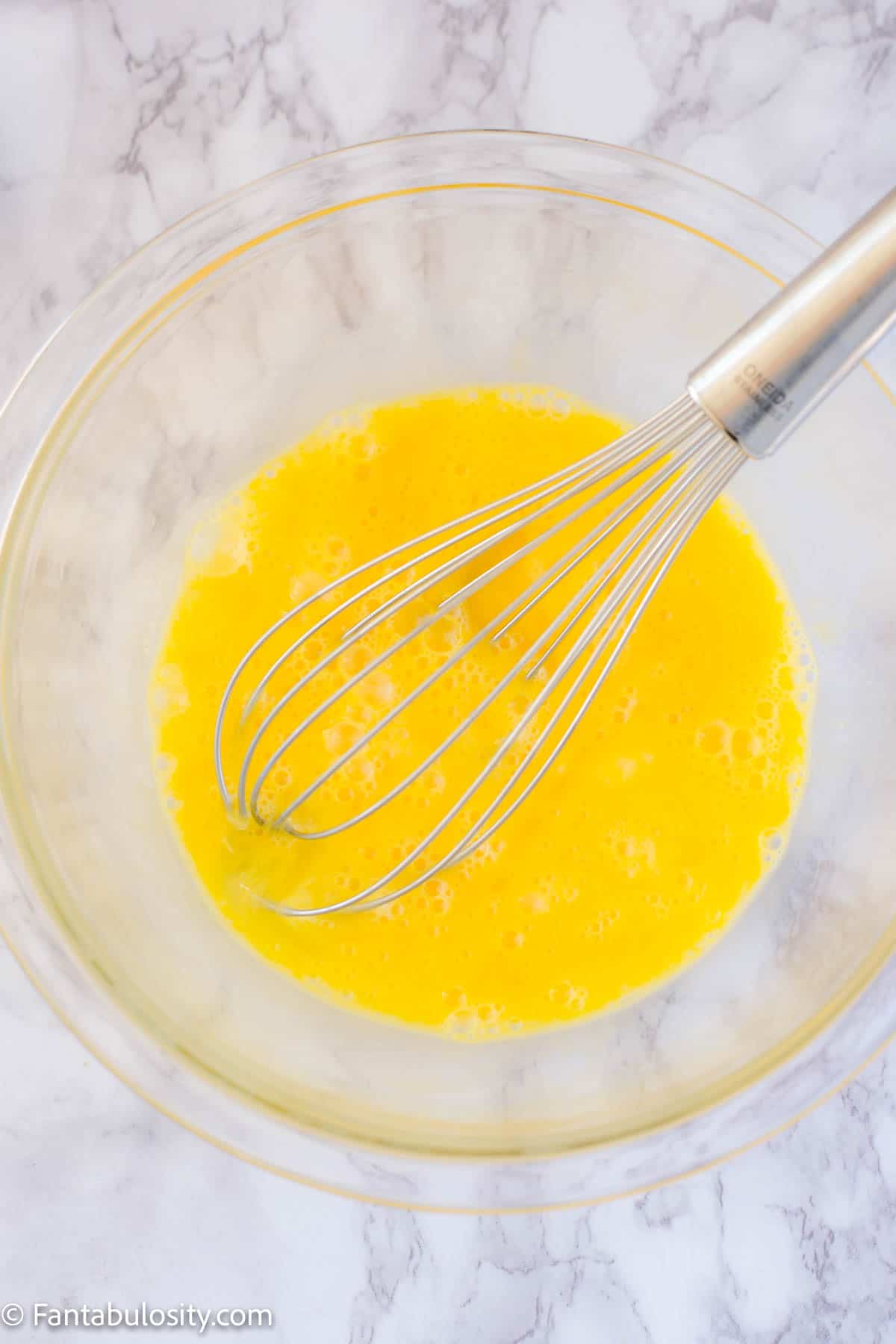 Whisked eggs in bowl 