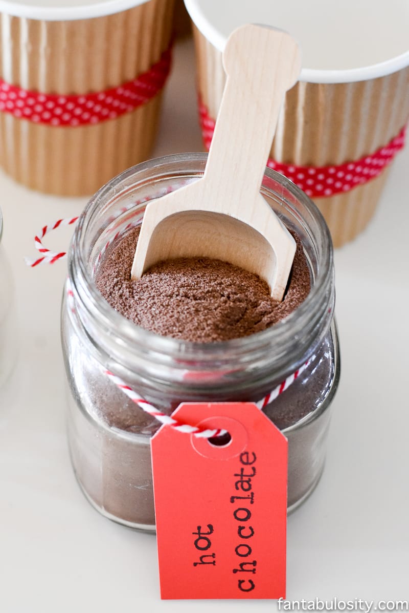 Such a cute idea! Hot chocolate station on a dessert table! Vintage Christmas Party Ideas: Truck with Christmas Tree, cupcakes, red green and white, hot chocolate bar