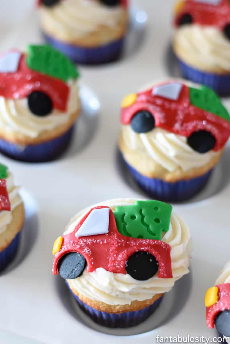 OMG! These cupcakes are ADORABLE! Vintage truck and tree for a party! Vintage Christmas Party Ideas: Truck with Christmas Tree, cupcakes, red green and white, hot chocolate bar