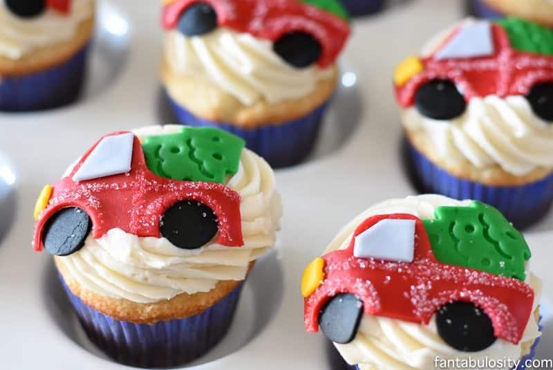 OMG! These cupcakes are ADORABLE! Vintage truck and tree for a party! Vintage Christmas Party Ideas: Truck with Christmas Tree, cupcakes, red green and white, hot chocolate bar