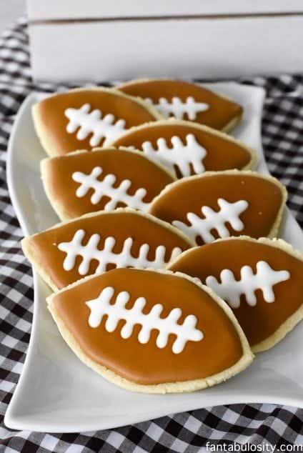 Football cookies DIY! So cute, and doable!!! Perfect for a football party. Football party ideas fantabulosity.com