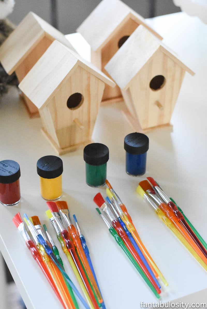 A Camp-In Sleepover! Birdhouse painting activity for a Camping Sleepover Birthday Party! How fun is this! It's all so cute!!! Camping Sleepover Birthday Party Ideas! Pottery Barn Kids, fake fire, tents, sleeping bags, fire birthday cake, kaleidoscope, birthday banner. 