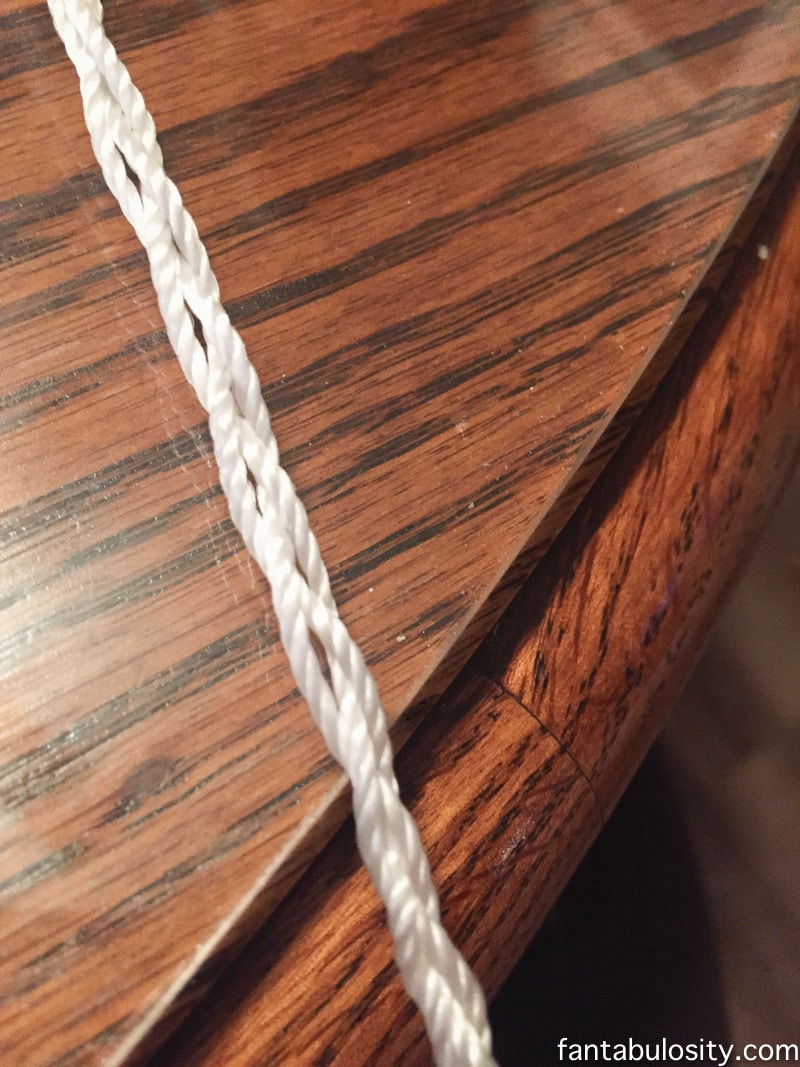 braid three strings of twisted mason line, to create the "hook," for the patio curtain tie backs https://fantabulosity.com