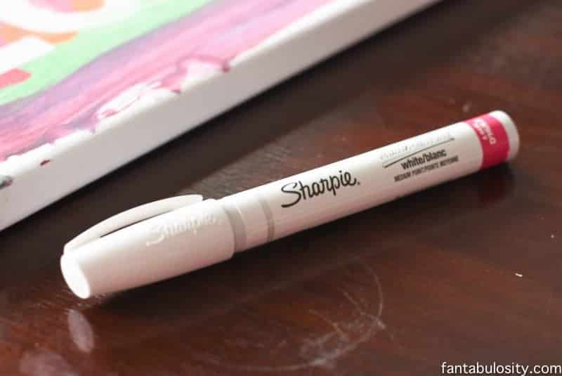 Use a white paint pen to erase finger paint