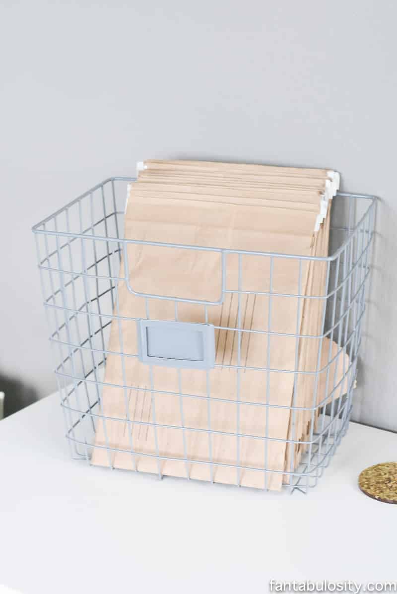 Wire basket to hold envelopes on desk for shipping products