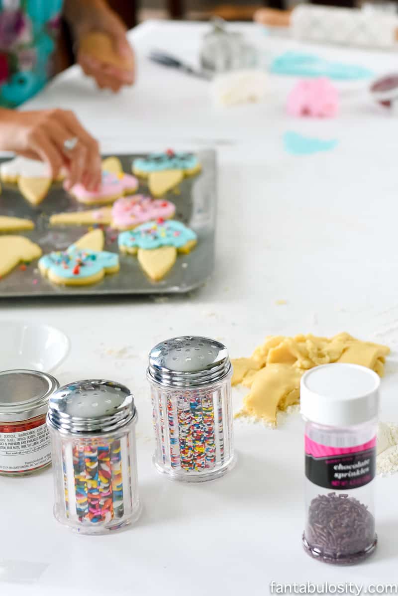 Decorating sugar cookies, with fondant instead of icing! So so cute!