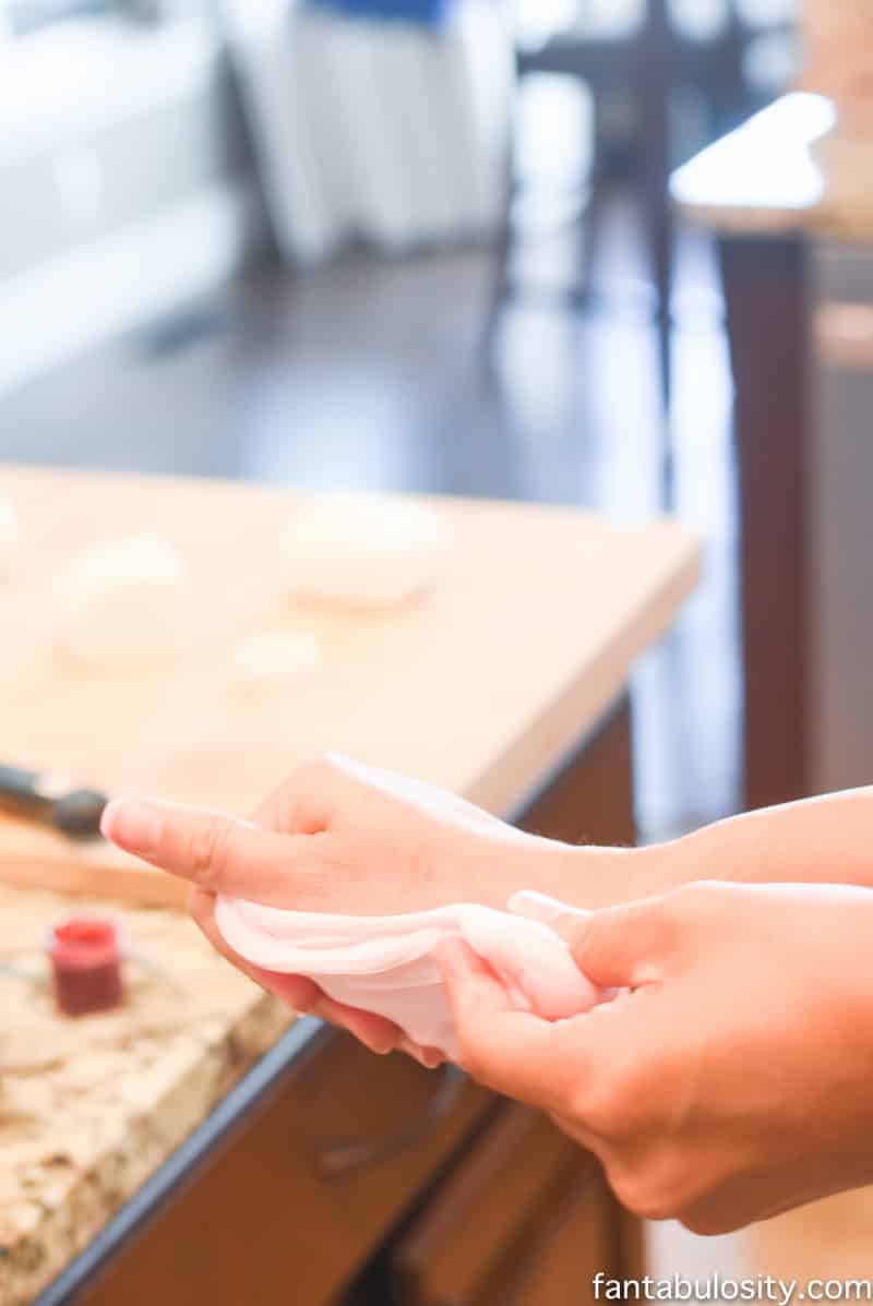 Use fondant and color with food coloring, instead of decorating cookies with icing