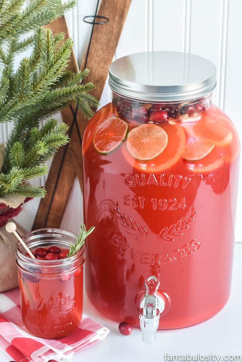 Fruit punch in drink dispenser and mason jar