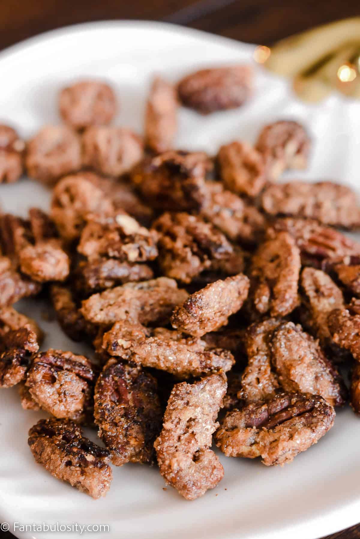 spiced pecans on white plate