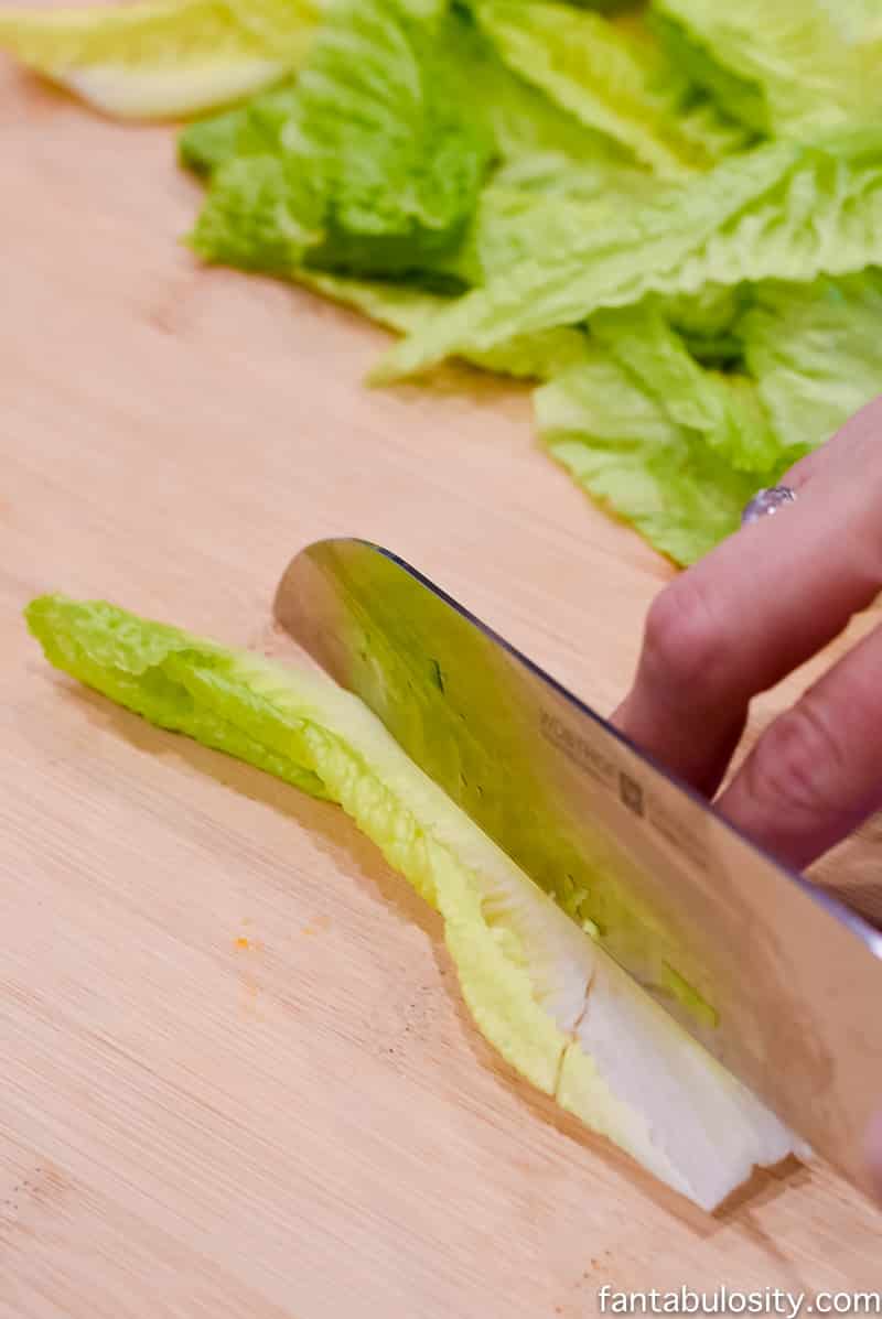 Cutting romaine lettuce and removing stems
