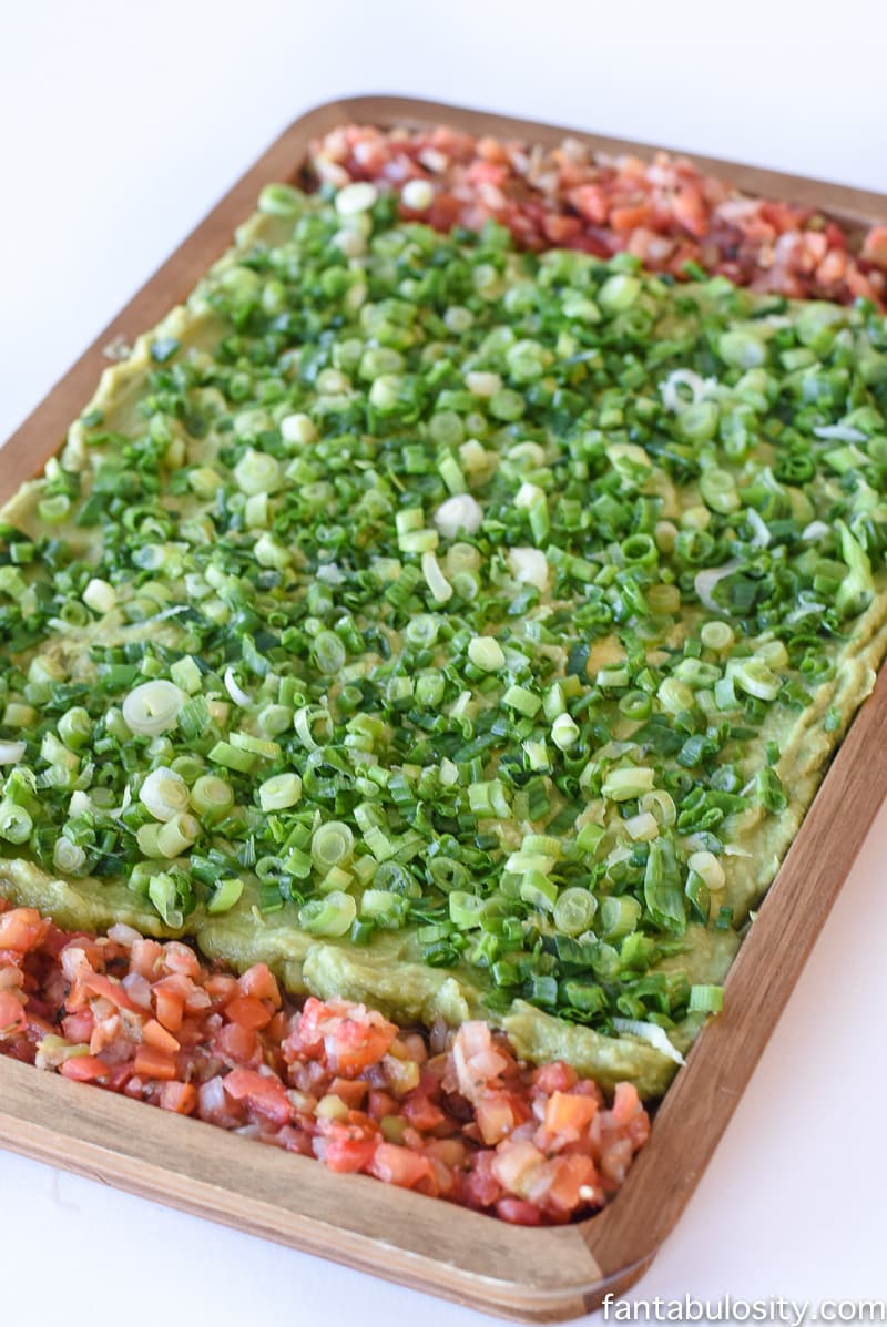 Football Party Food: Field made of guacamole and pico de gallo, then a football shaped dip! So fun!