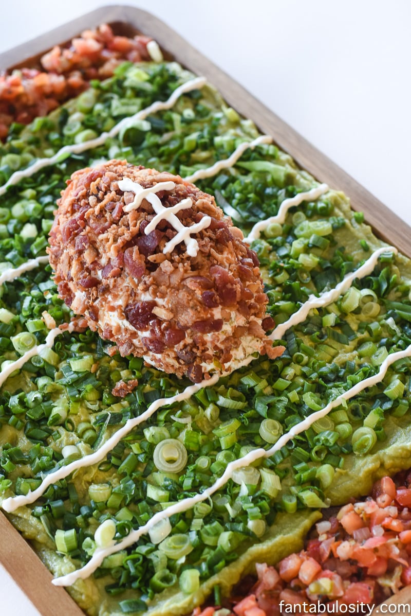 Football Party Food: Field made of guacamole and pico de gallo, then a football shaped dip! So fun!