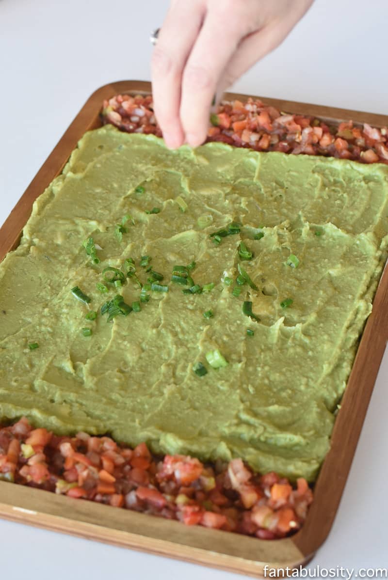 Football Party Food: Field made of guacamole and pico de gallo, then a football shaped dip! So fun!