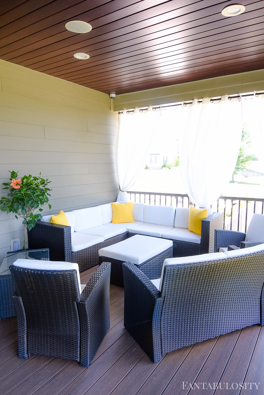 Craftsman Home Patio. Back patio seating area with couch/sectional and white cushions! Perfect with a craftsman home style.