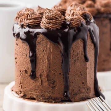 Mini chocolate cake on small cake stand.