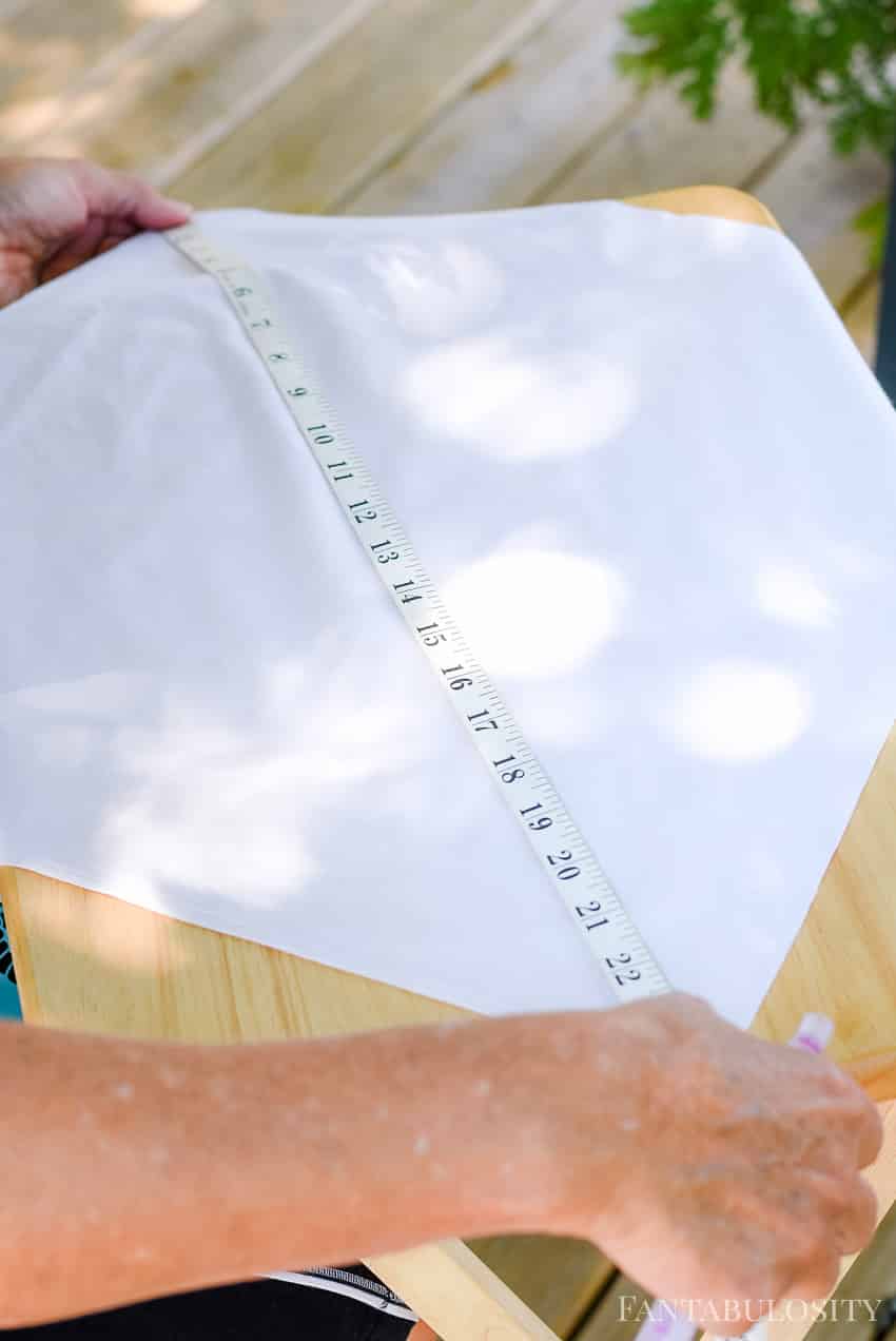 Measure to the center of the pillow cover to know where to center the stencil