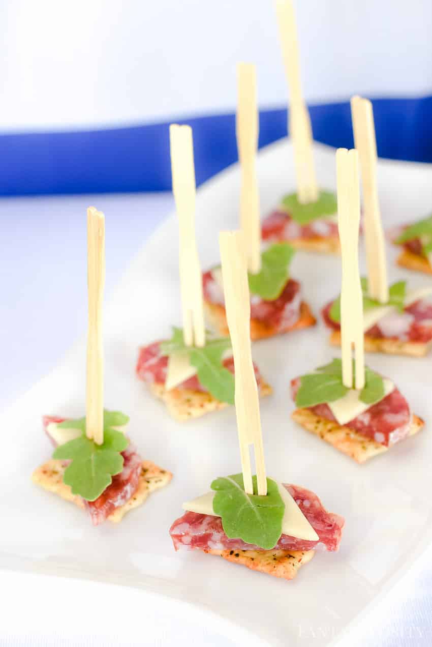 So cute, classy and easy!! My favorite party appetizer combination! Salami, cheese, watercress on a crack. Adorable! Summer soiree food idea!