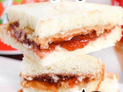 Stacked peanut butter and jelly sandwiches with text on image