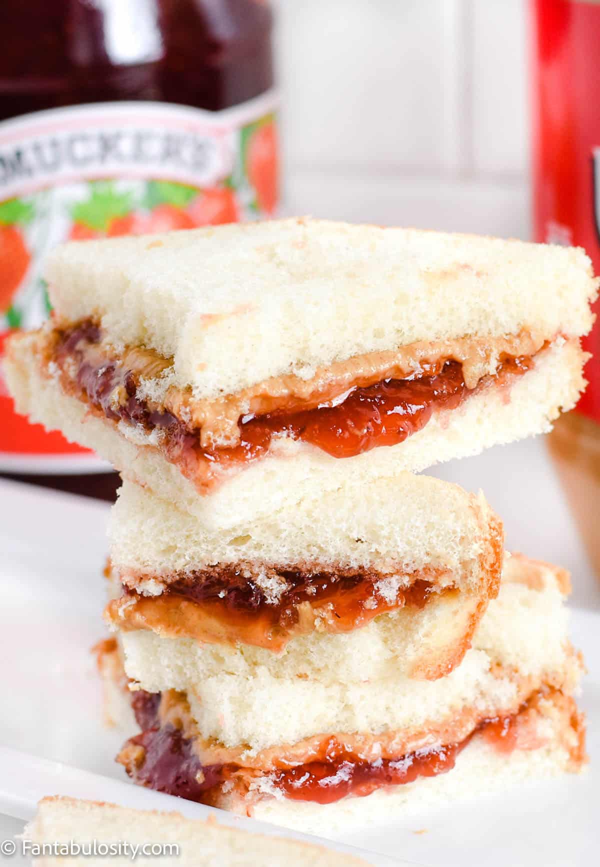 peanut butter and jelly sandwiches stacked on top of one another