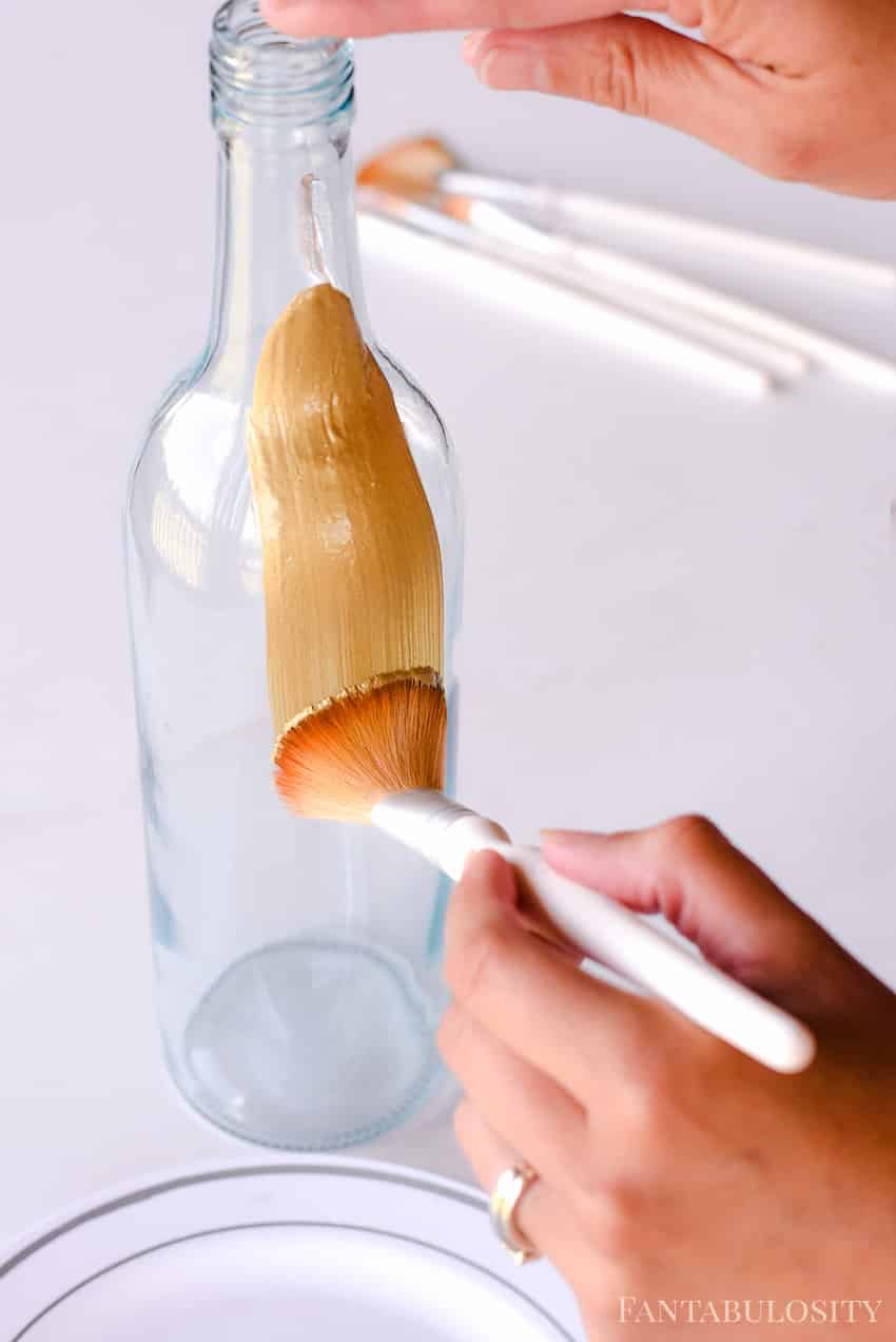 Painting a wine bottle to make a vase for party decor - wine bottle crafts