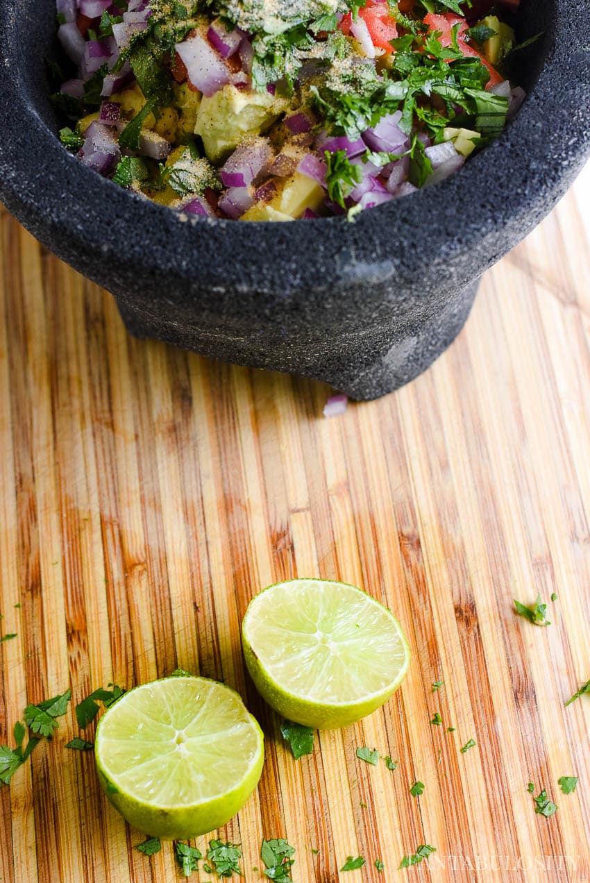 Add juice from a lime in to the fresh guacamole recipe