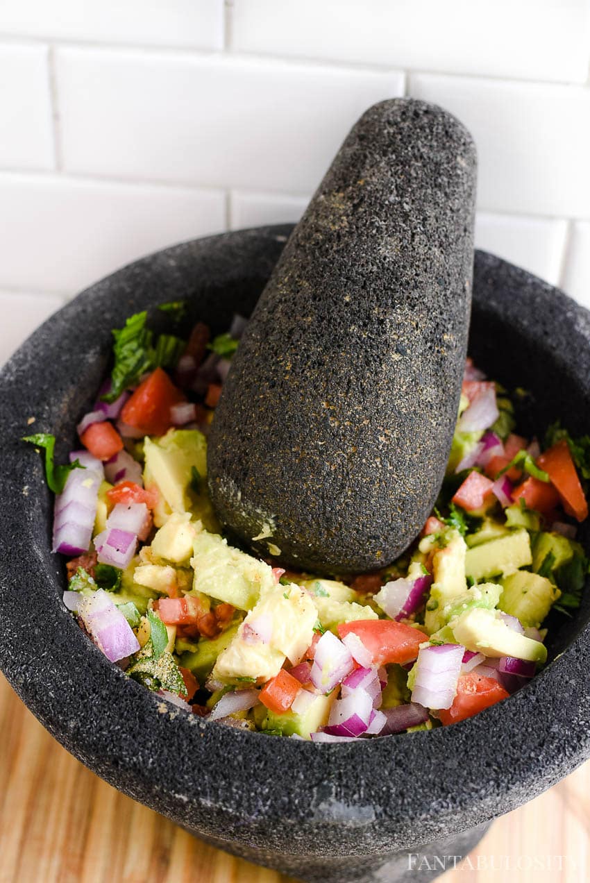 Use a molcajete to mash up the guacamole ingredients, or a fork!