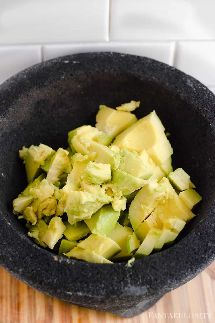 I like to cut my avocados to make mashing in a molcajete easier