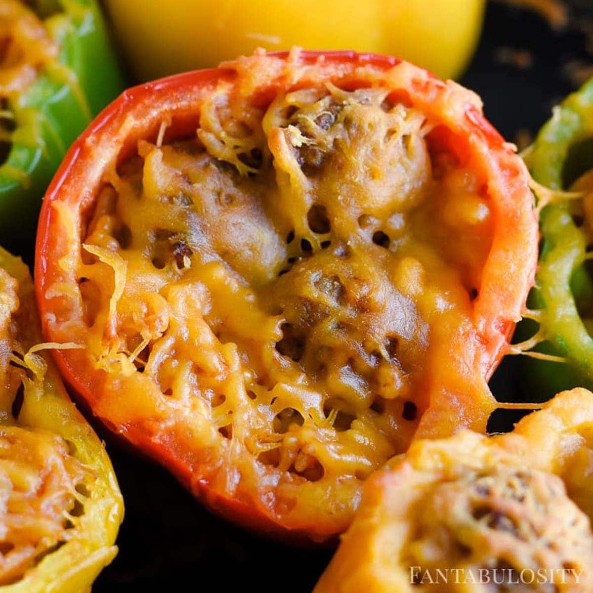 Bell peppers stuffed with meatballs and rice.