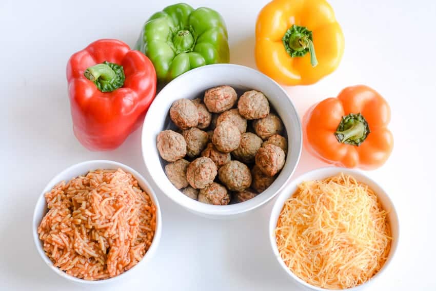 Ingredients for one of our family favorite weeknight meals. Easy Meatball Stuffed Peppers - beef meatballs, cheese, rice... it's so quick and easy! 