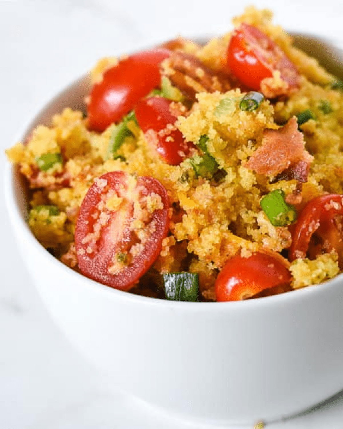 Cornbread salad with tomatoes and green onions