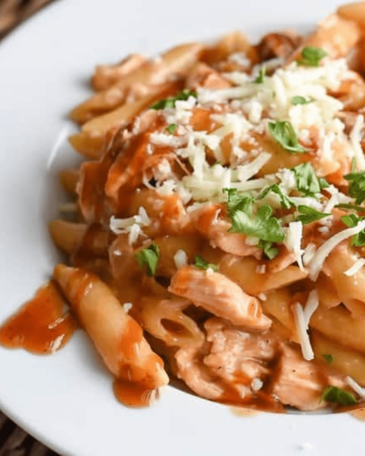 BBQ chicken pasta on a white plate