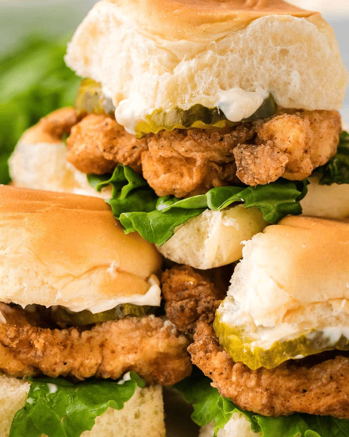 Fried chicken sliders with lettuce and pickles 