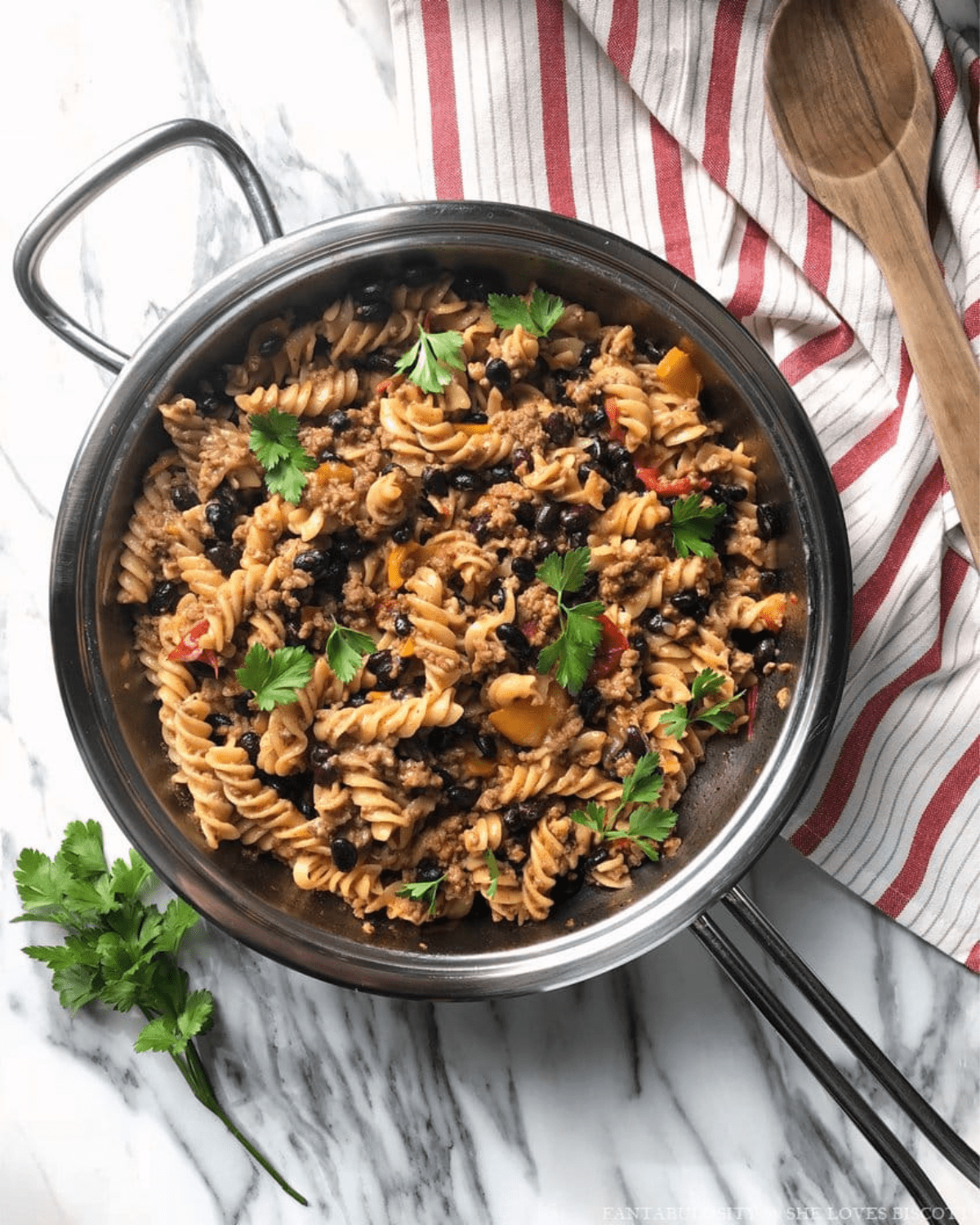 Taco pasta in a skillet with black beans