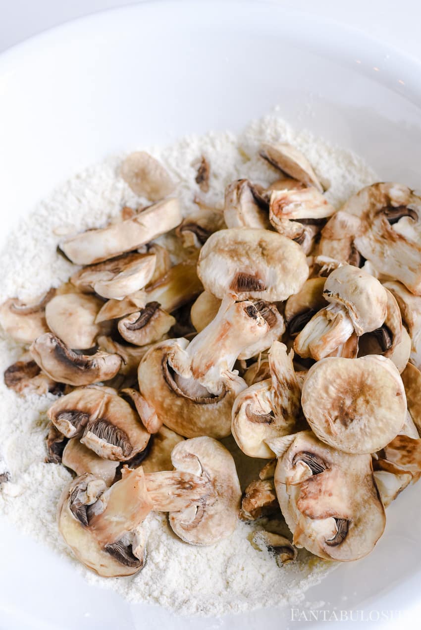 Toss mushrooms in flour and seasoning for easy fried mushrooms recipe.