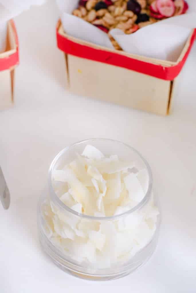 Coconut flakes for a yogurt and ice cream bar topping idea. DIY yogurt and build your own pudding bar