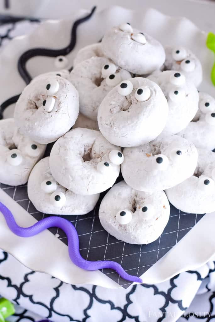 Halloween Donuts - Candy Eyes and white powdered donuts. So cute for a halloween party idea