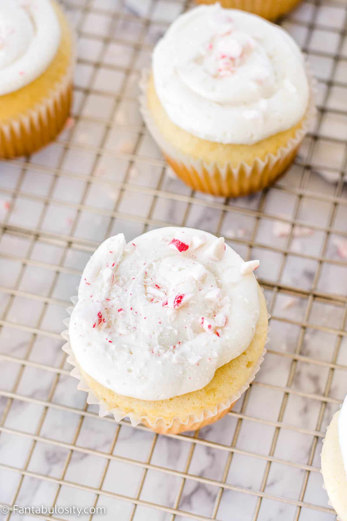 Peppermint candies on top of cupcakes