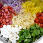 ingredients in bowl for zesty Italian pasta salad