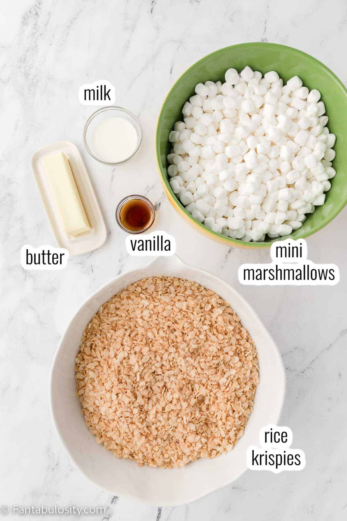 Ingredients for rice krispie treats on a white counter.