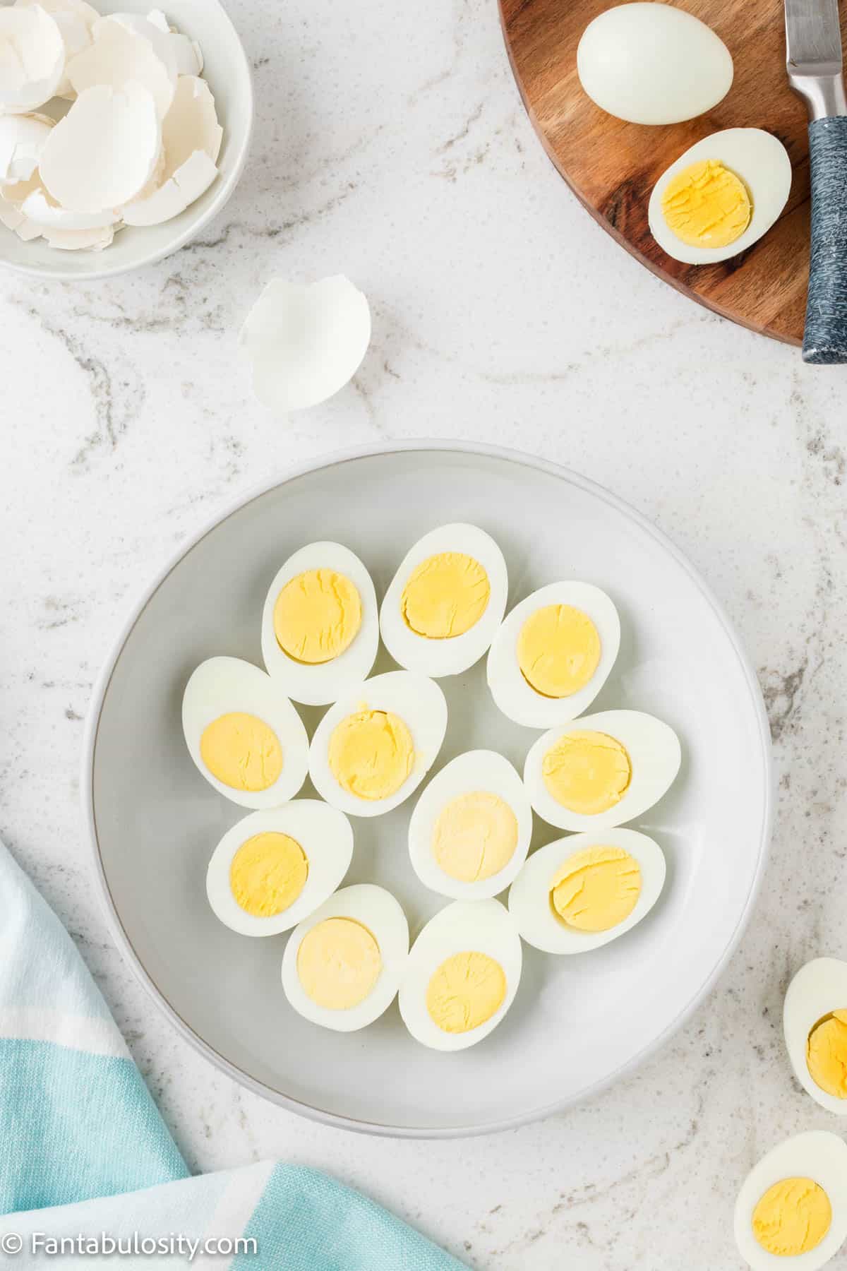 Sliced hard boiled eggs on plate