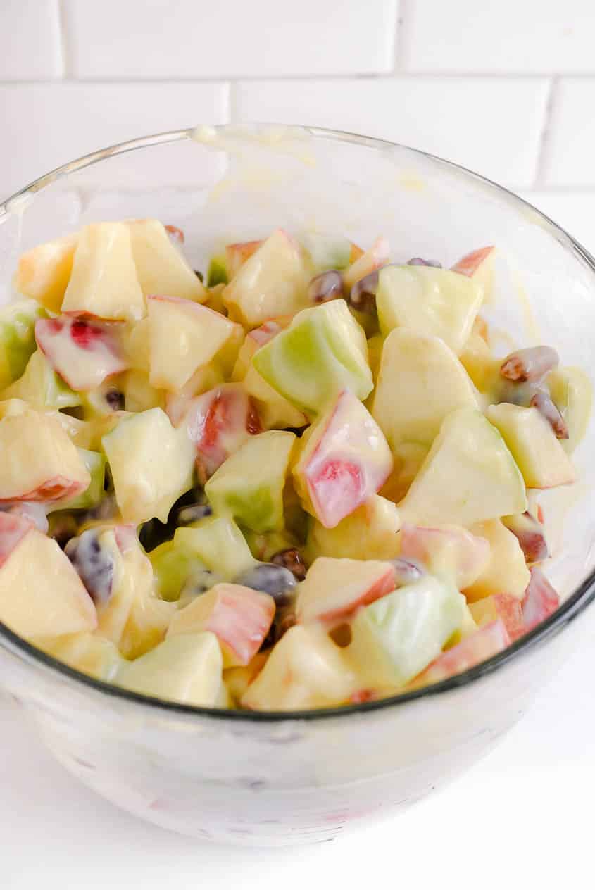 Mix together ingredients for apple salad